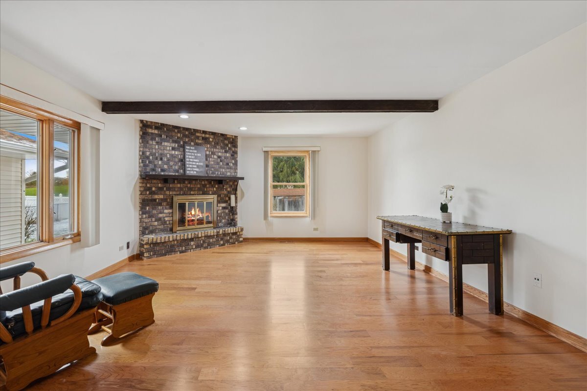 612 White Pine Road Buffalo Grove, IL 60089 - Photo 5 of 24 a living room with furniture and a fireplace