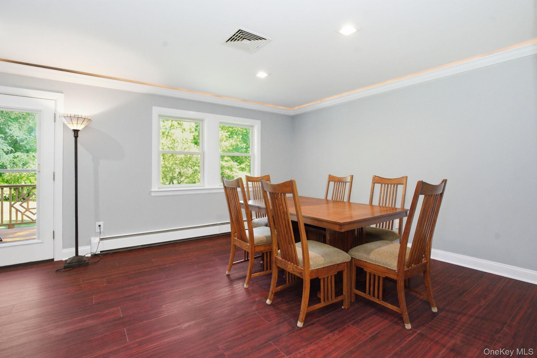 35 Deans Bridge Road Somers, NY 10589 - Photo 10 of 49 Step-out access to the deck makes this dining space as easy for morning coffee as it is for hosting.
