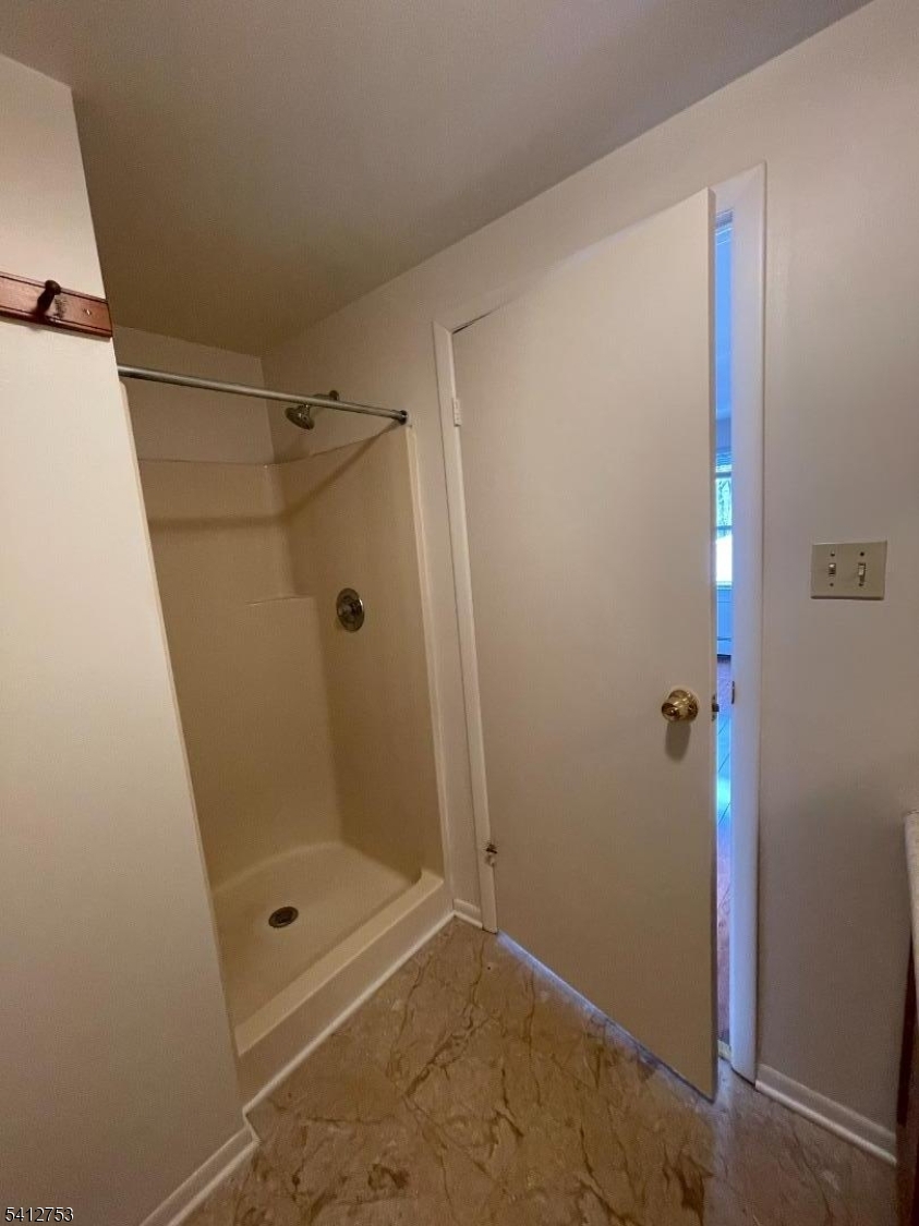278 Morris Street Stirling, NJ 07980 - Photo 14 of 20 a bathroom with a glass shower door
