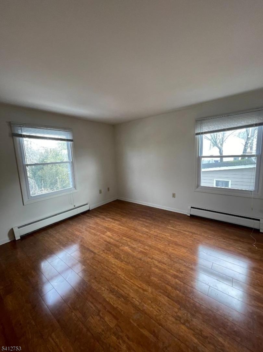 278 Morris Street Stirling, NJ 07980 - Photo 15 of 20 an empty room with wooden floor and windows