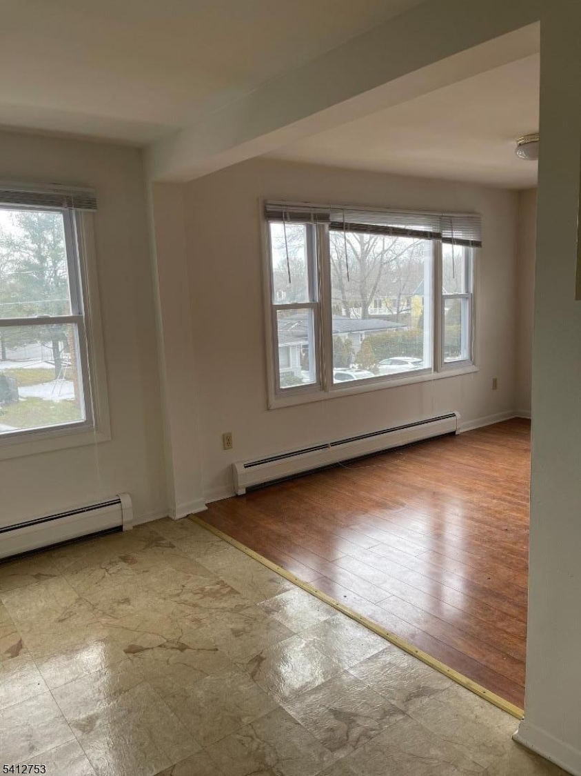 278 Morris Street Stirling, NJ 07980 - Photo 9 of 20 an empty room with wooden floor and windows