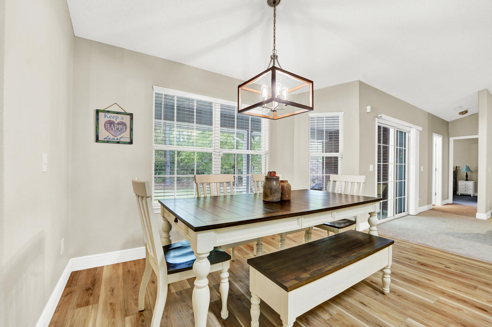 304 Greyfox Circle Crestview, FL 32536 - Photo 16 of 49 a kitchen with a table chairs and wooden floor