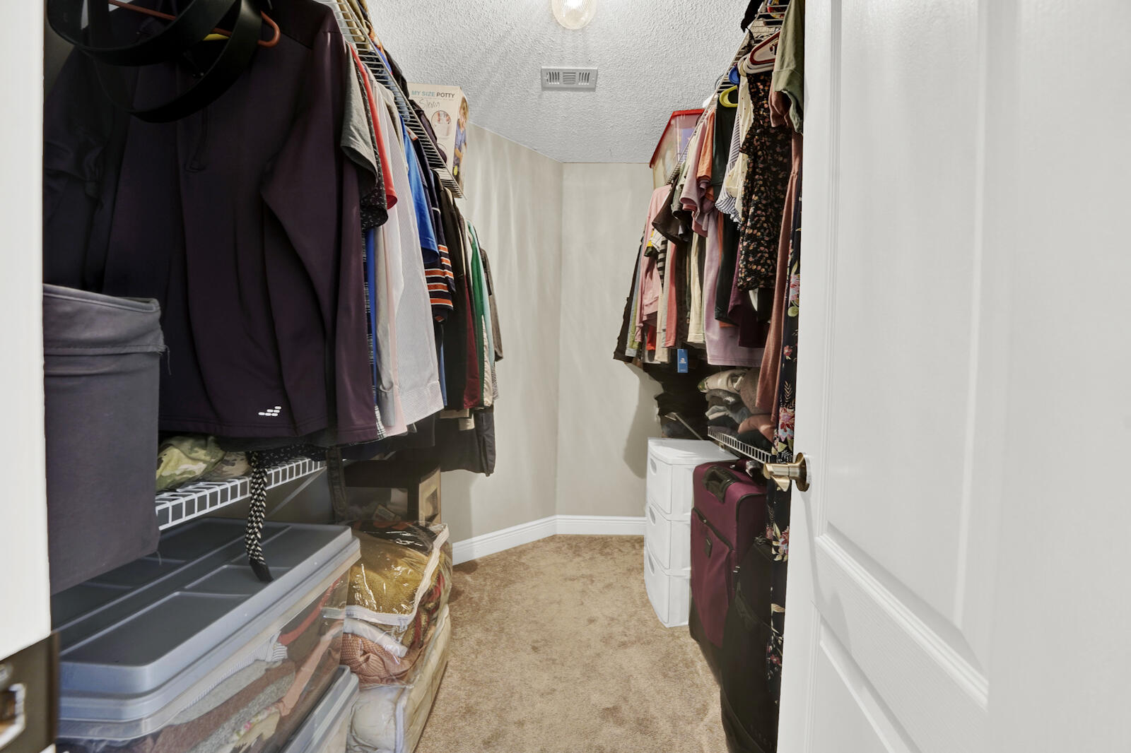 304 Greyfox Circle Crestview, FL 32536 - Photo 28 of 49 a view of walk in closet with clothes and shoes