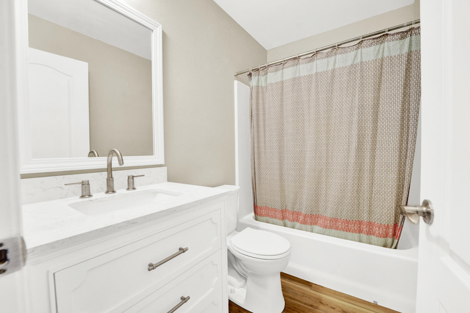 304 Greyfox Circle Crestview, FL 32536 - Photo 31 of 49 a bathroom with a sink a toilet a mirror and shower curtain
