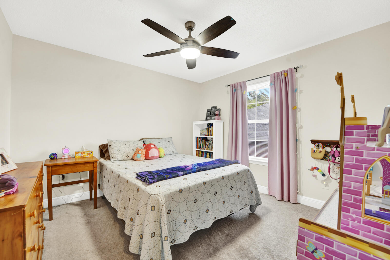 304 Greyfox Circle Crestview, FL 32536 - Photo 32 of 49 a bed room with a bed and a chandelier