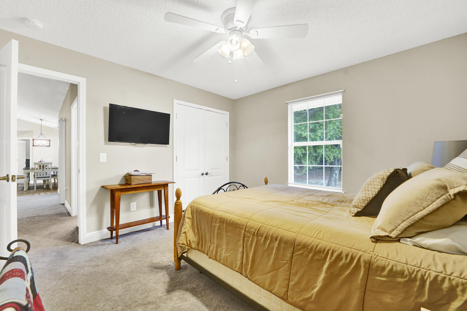 304 Greyfox Circle Crestview, FL 32536 - Photo 36 of 49 a bedroom with a bed and a flat screen tv