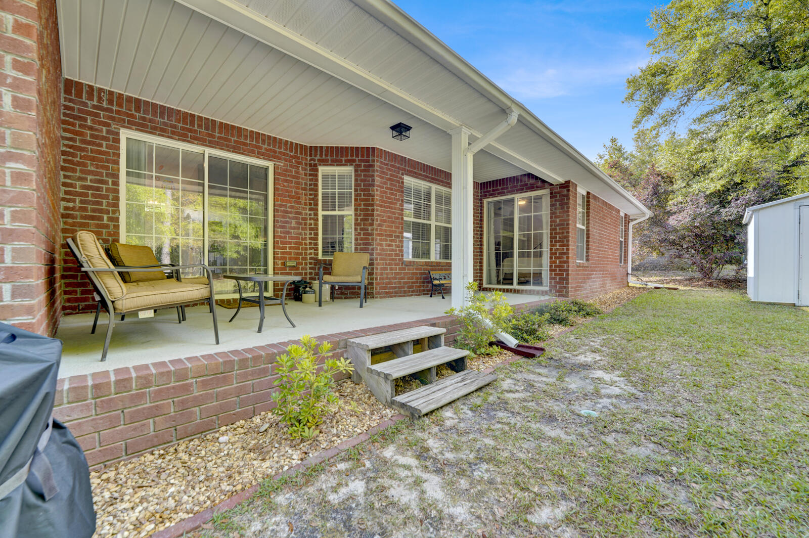 304 Greyfox Circle Crestview, FL 32536 - Photo 38 of 49 a view of a house with backyard porch and sitting area