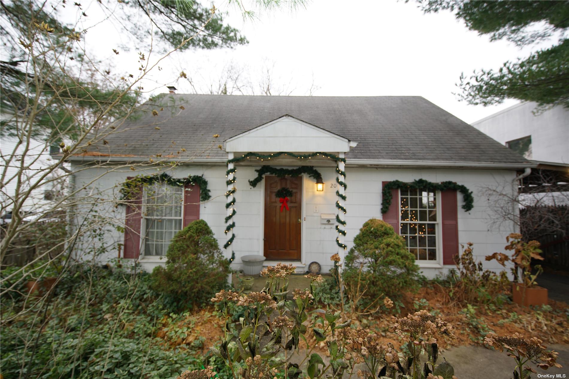 20 Valley Road Port Washington, NY 11050 - Photo 1 of 1 a front view of house with yard