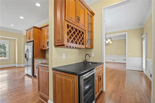 a kitchen that has a sink and a stove in it
