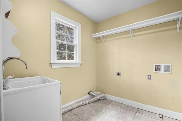 a view of storage and utility room with washer and dryer