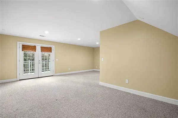 a view of an empty room with a bathroom