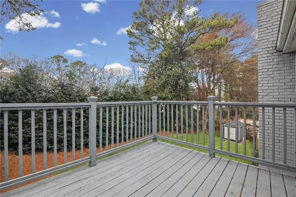 a view of an outdoor dining space with a table and chairs