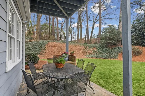 a view of a house with a yard and garage