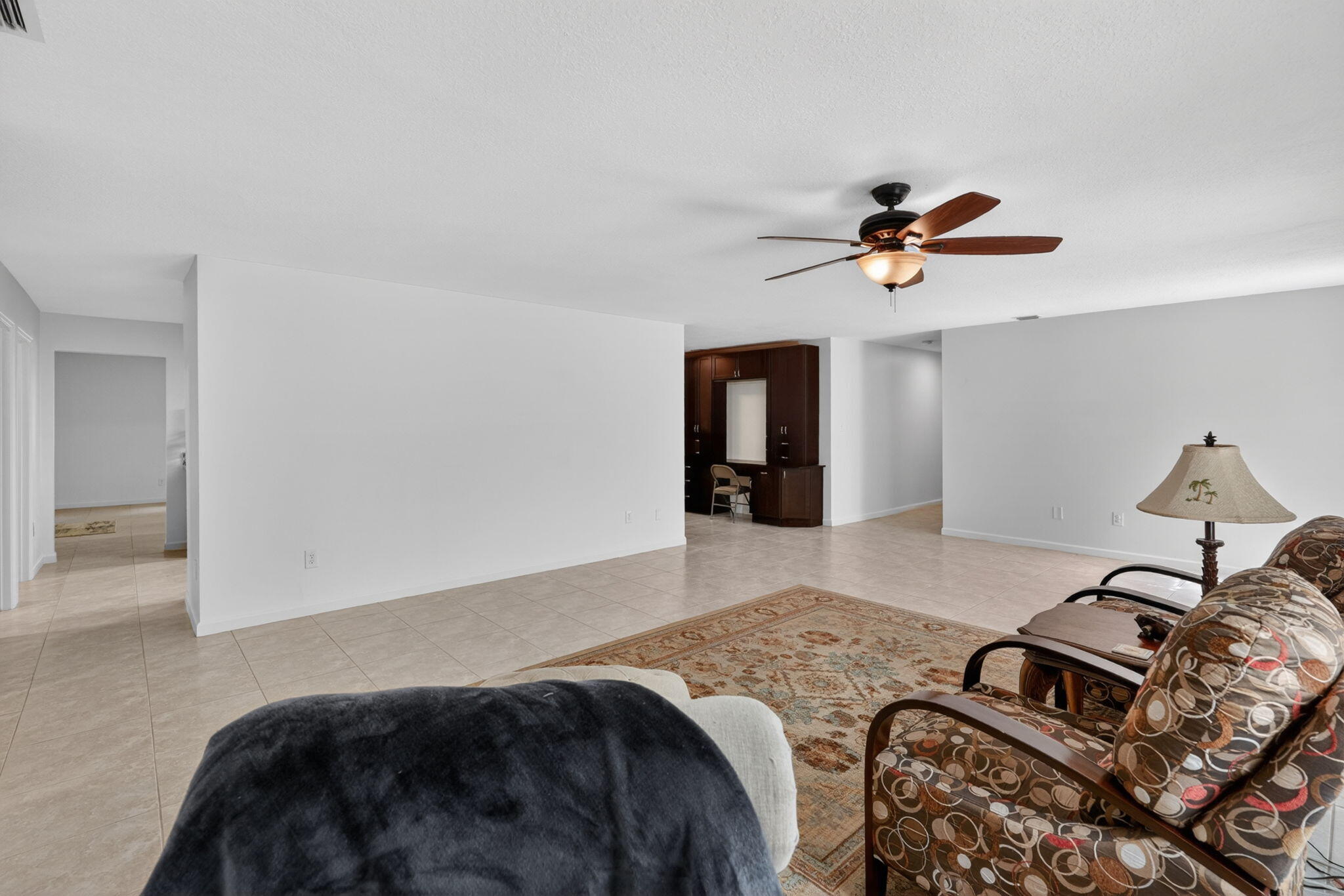 17391 Alexander Run Jupiter, FL 33478 - Photo 6 of 55 a bedroom with a bed and a chandelier