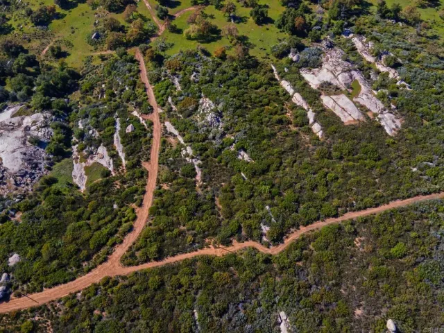 a view of an ocean with a mountain in the background