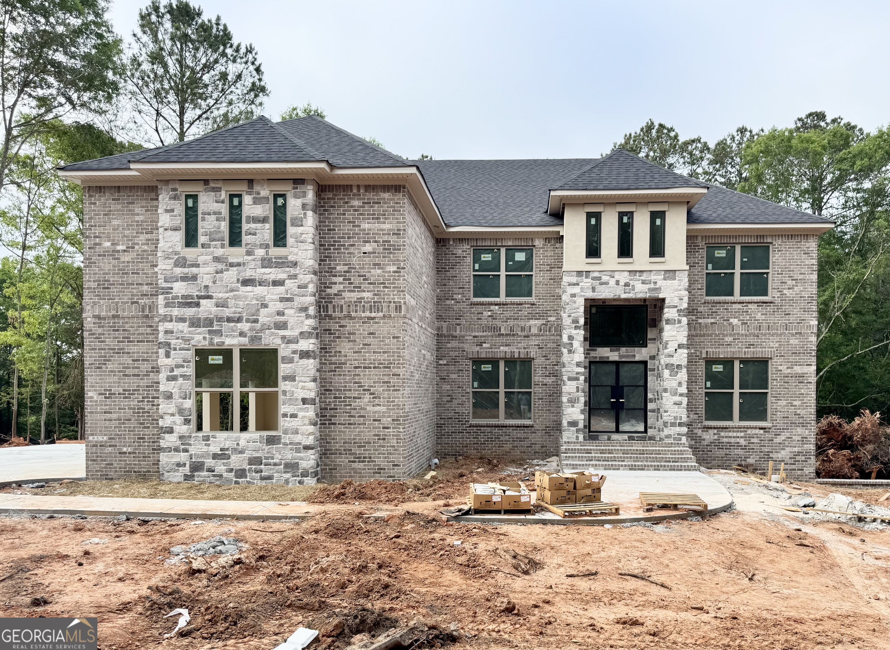1306 New Hope Church Road, Unit 4 Loganville, GA 30052 - Photo 1 of 3 a front view of a house with a yard