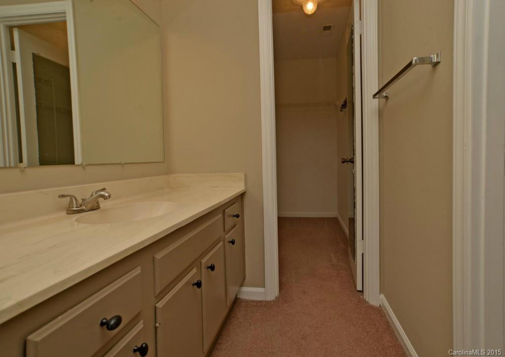 4731 Rounding Run Road Charlotte, NC 28277 - Photo 16 of 24 a bathroom with a sink and a mirror