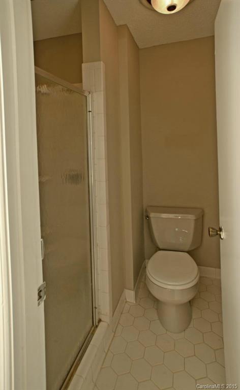 4731 Rounding Run Road Charlotte, NC 28277 - Photo 17 of 24 a white toilet sitting next to a shower
