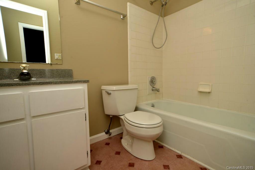 4731 Rounding Run Road Charlotte, NC 28277 - Photo 19 of 24 a bathroom with a granite countertop toilet sink and mirror