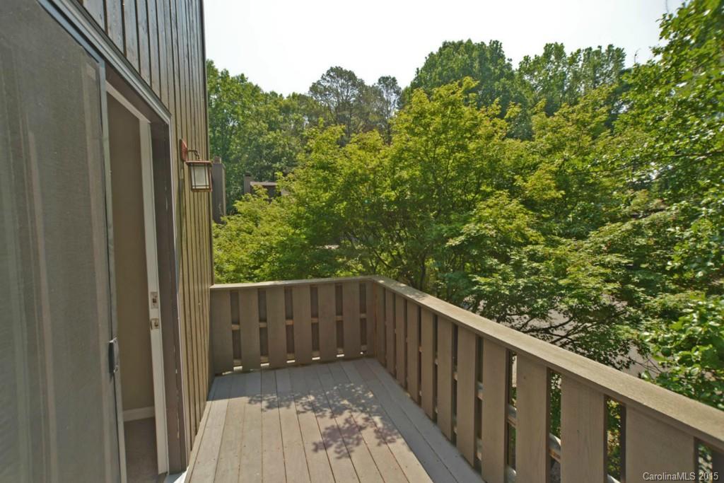4731 Rounding Run Road Charlotte, NC 28277 - Photo 21 of 24 a balcony with wooden floor and fence