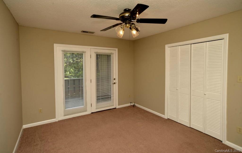 4731 Rounding Run Road Charlotte, NC 28277 - Photo 22 of 24 an empty room with a ceiling fan and a chandelier fan