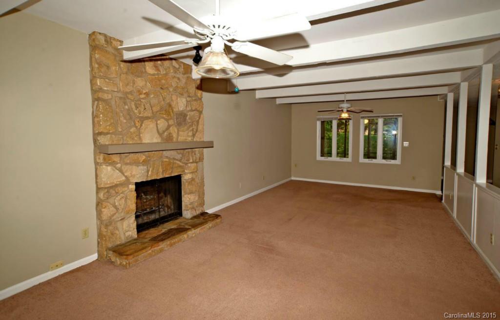 4731 Rounding Run Road Charlotte, NC 28277 - Photo 5 of 24 a view of an empty room with a fireplace and a window