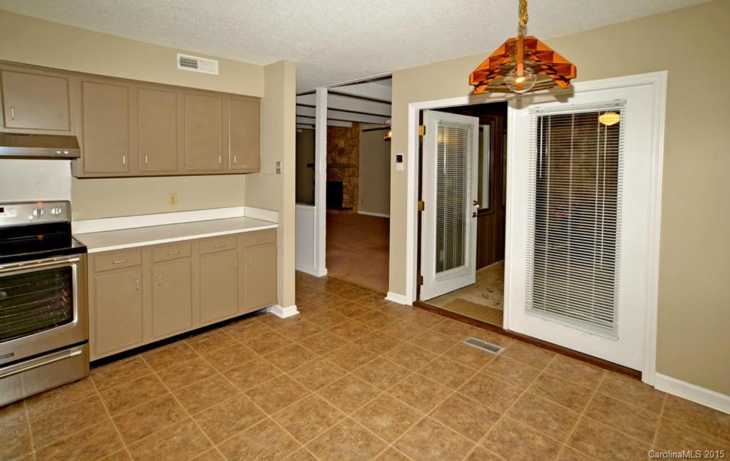 4731 Rounding Run Road Charlotte, NC 28277 - Photo 8 of 24 a view of a kitchen with a dishwasher and a refrigerator