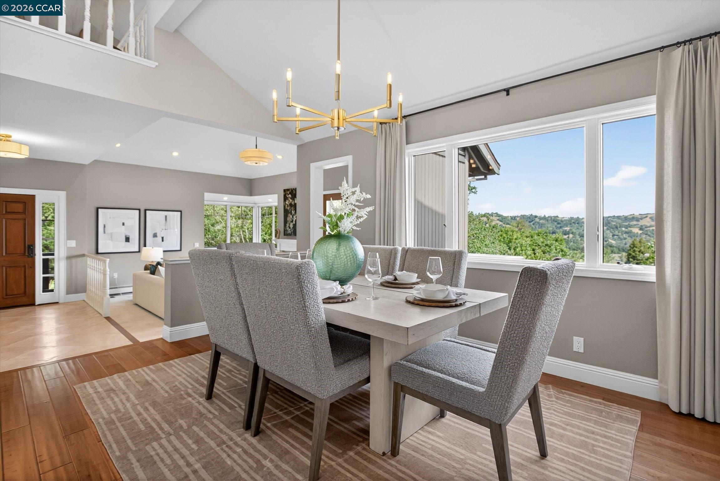 4105 Coralee Lane Lafayette, CA 94549 - Photo 13 of 43 a dining room with furniture a chandelier and wooden floor