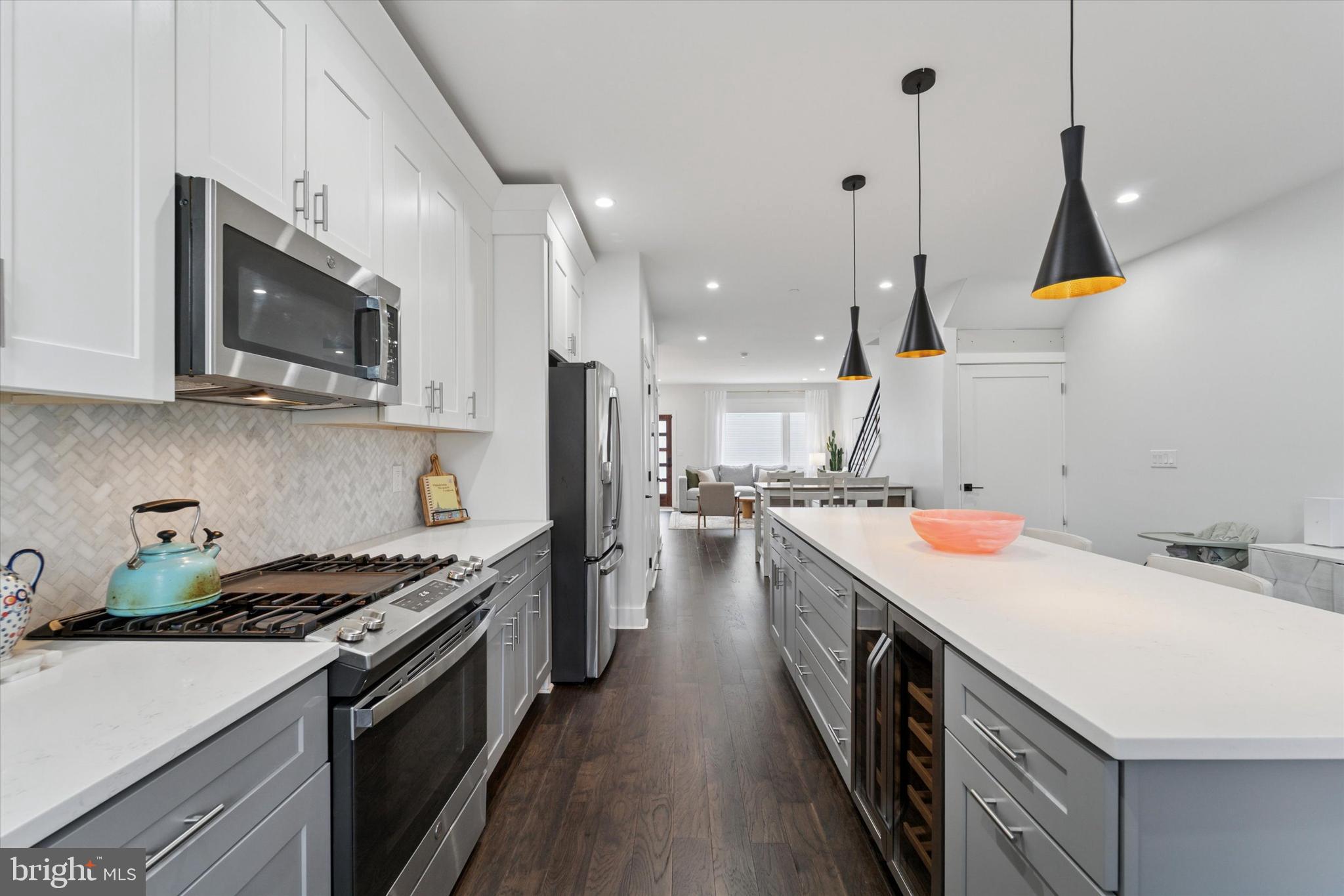 73 East Sharpnack Street Philadelphia, PA 19119 - Photo 11 of 50 a kitchen with a sink a stove and cabinets