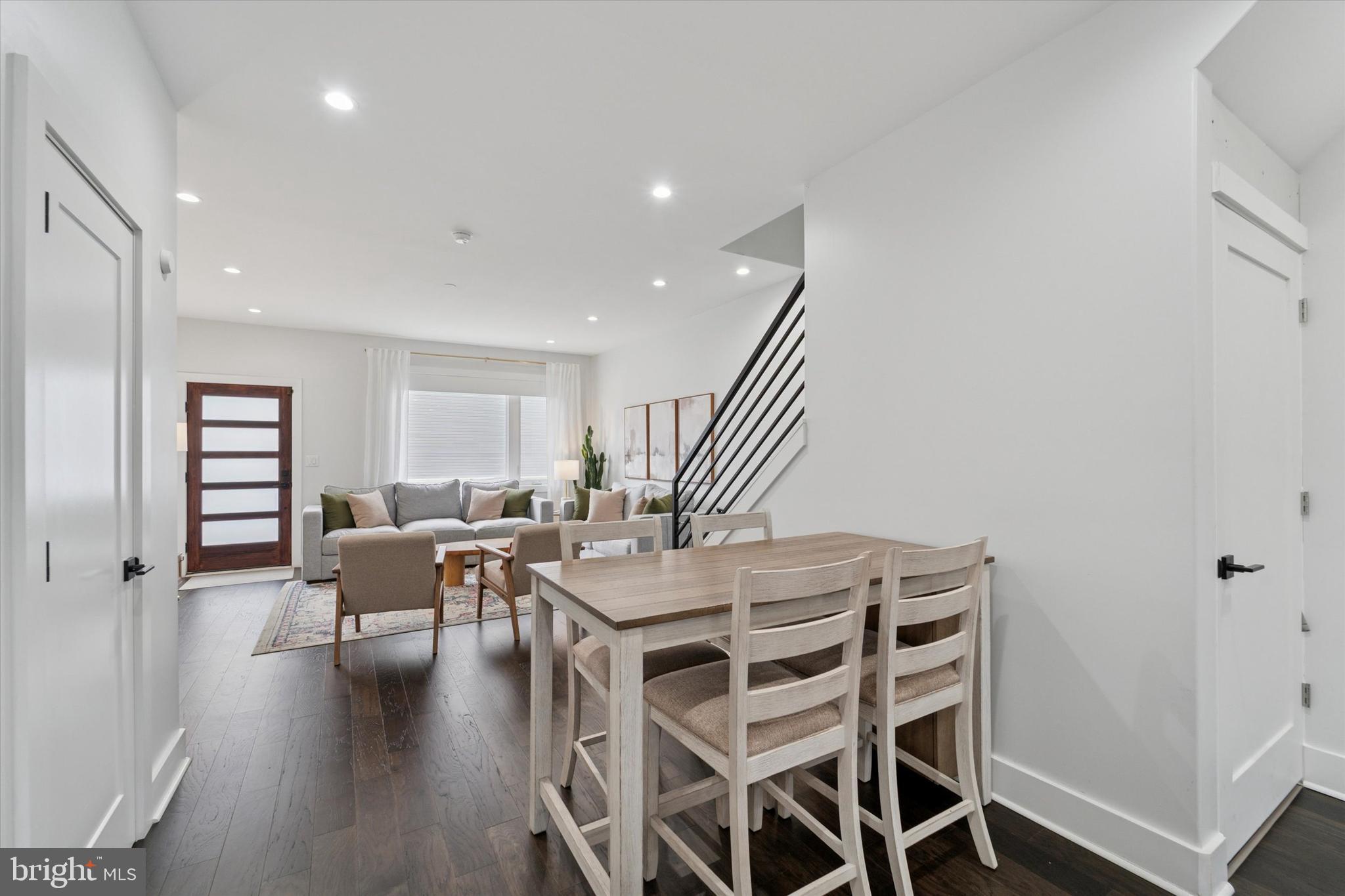73 East Sharpnack Street Philadelphia, PA 19119 - Photo 12 of 50 a view of a dining room with furniture and wooden floor