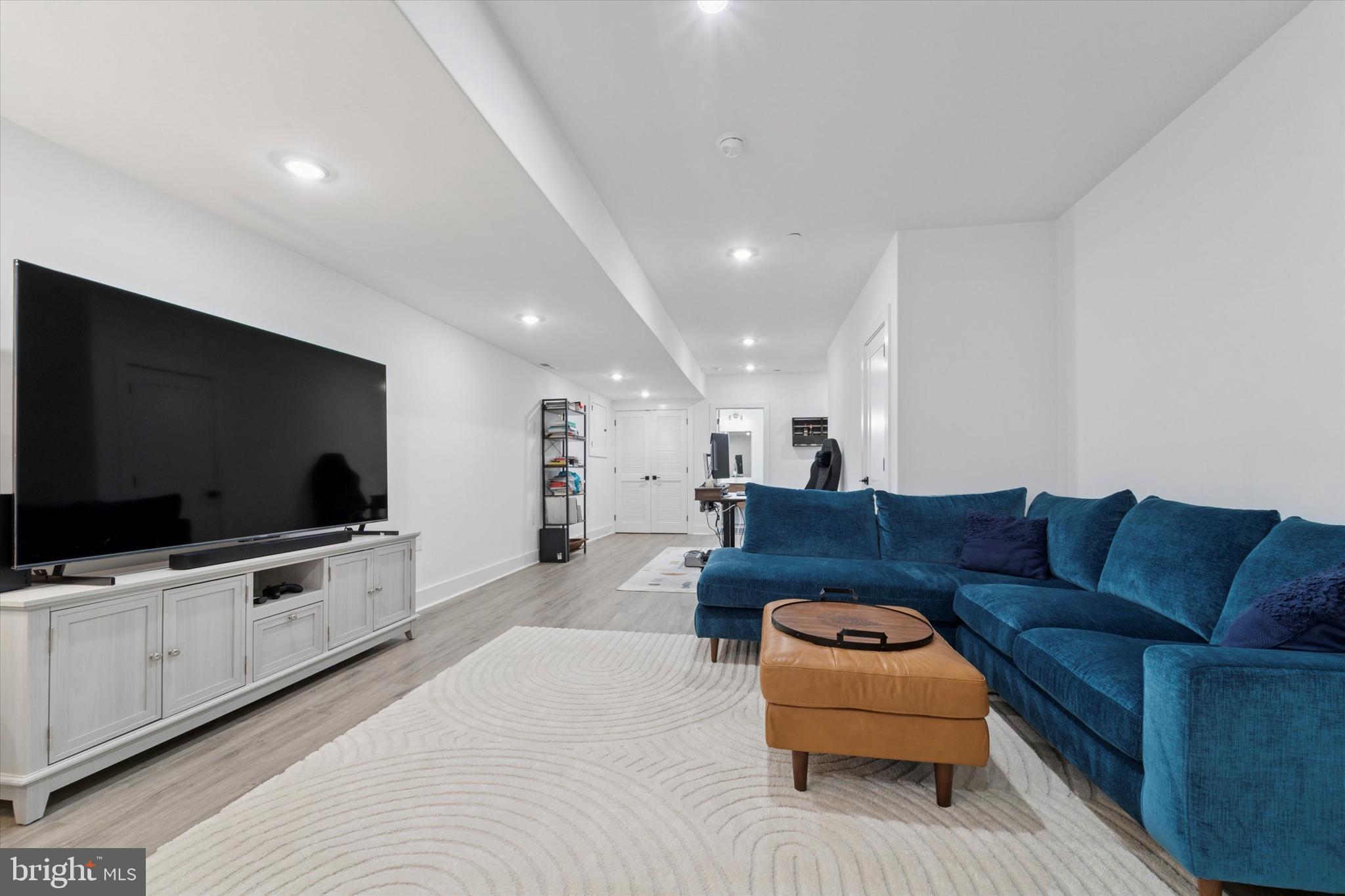 73 East Sharpnack Street Philadelphia, PA 19119 - Photo 15 of 50 a living room with furniture and a flat screen tv