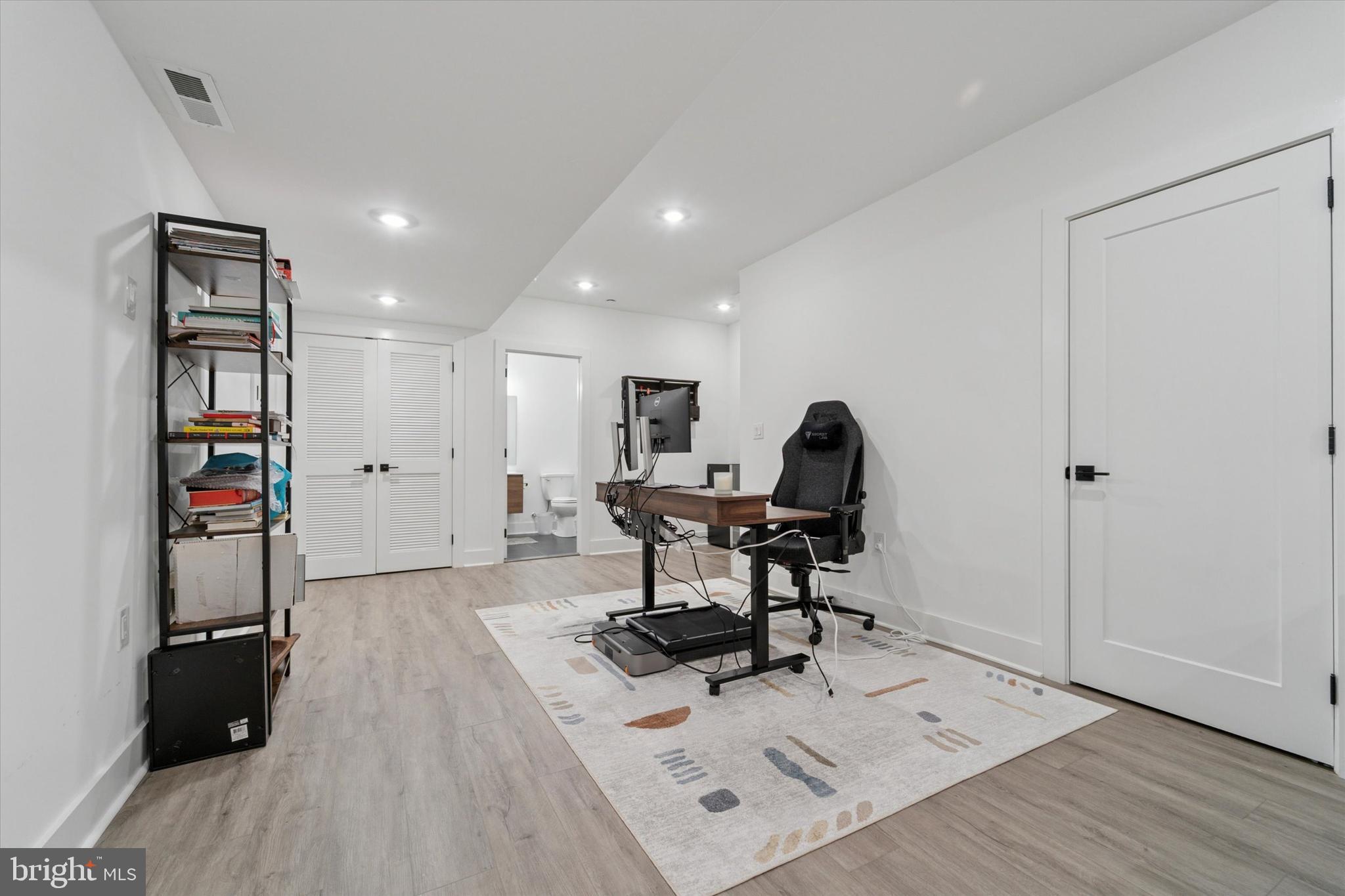 73 East Sharpnack Street Philadelphia, PA 19119 - Photo 17 of 50 a workspace with furniture and wooden floor