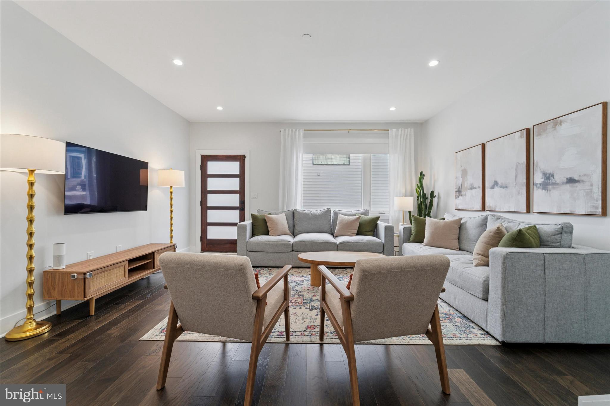 73 East Sharpnack Street Philadelphia, PA 19119 - Photo 19 of 50 a view of a dining room with furniture a rug and wooden floor