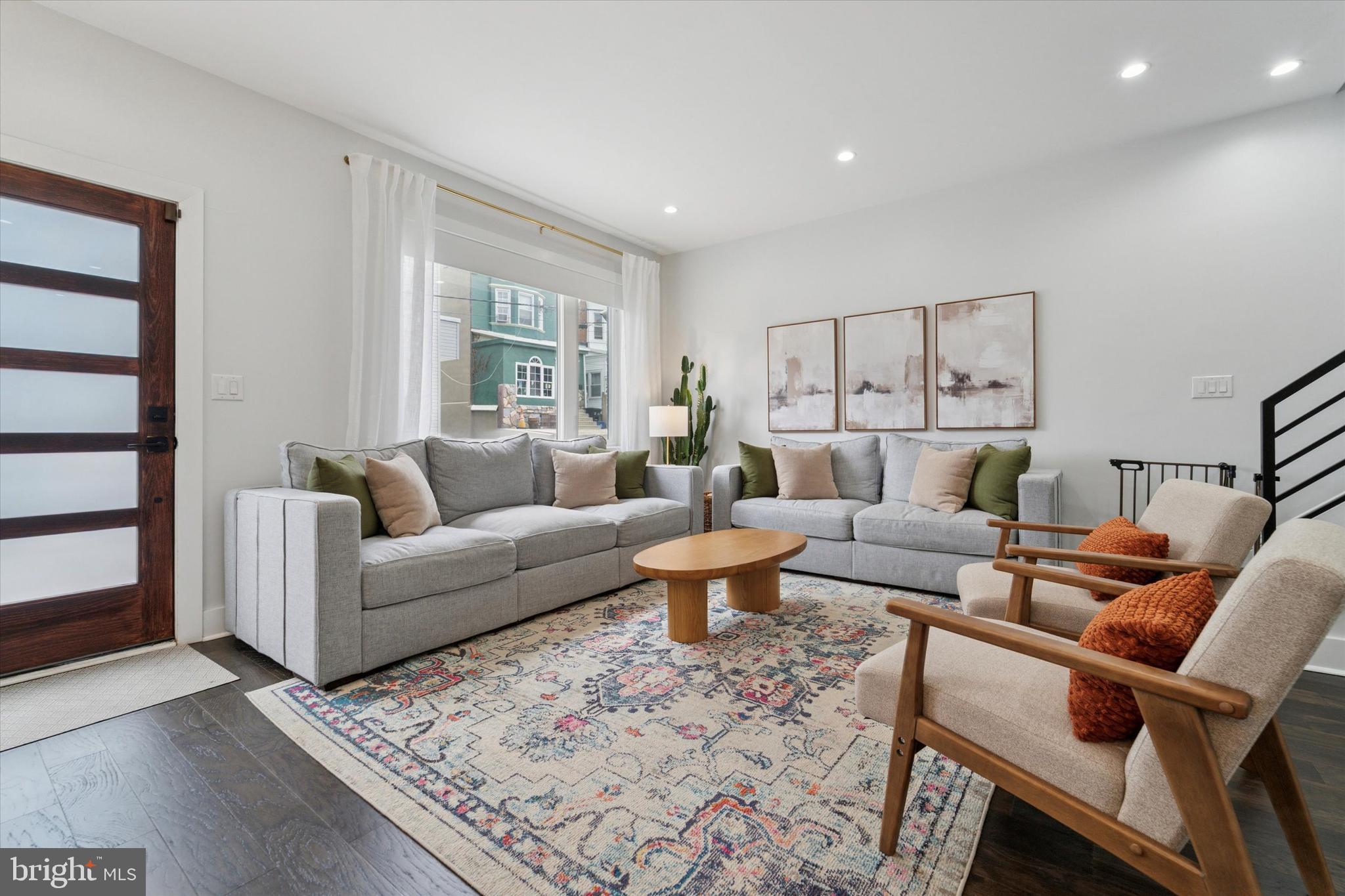 73 East Sharpnack Street Philadelphia, PA 19119 - Photo 20 of 50 a living room with furniture fireplace and a window