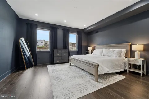 a bedroom with a bed and a lamp