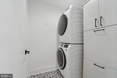 a bathroom with a sink mirror and a bathtub