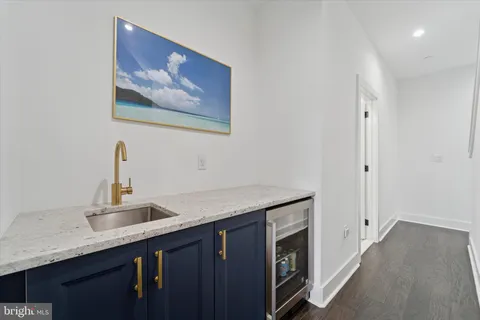 a bathroom with a sink a toilet and shower curtain