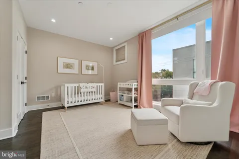 a view of a bedroom with furniture and staircase