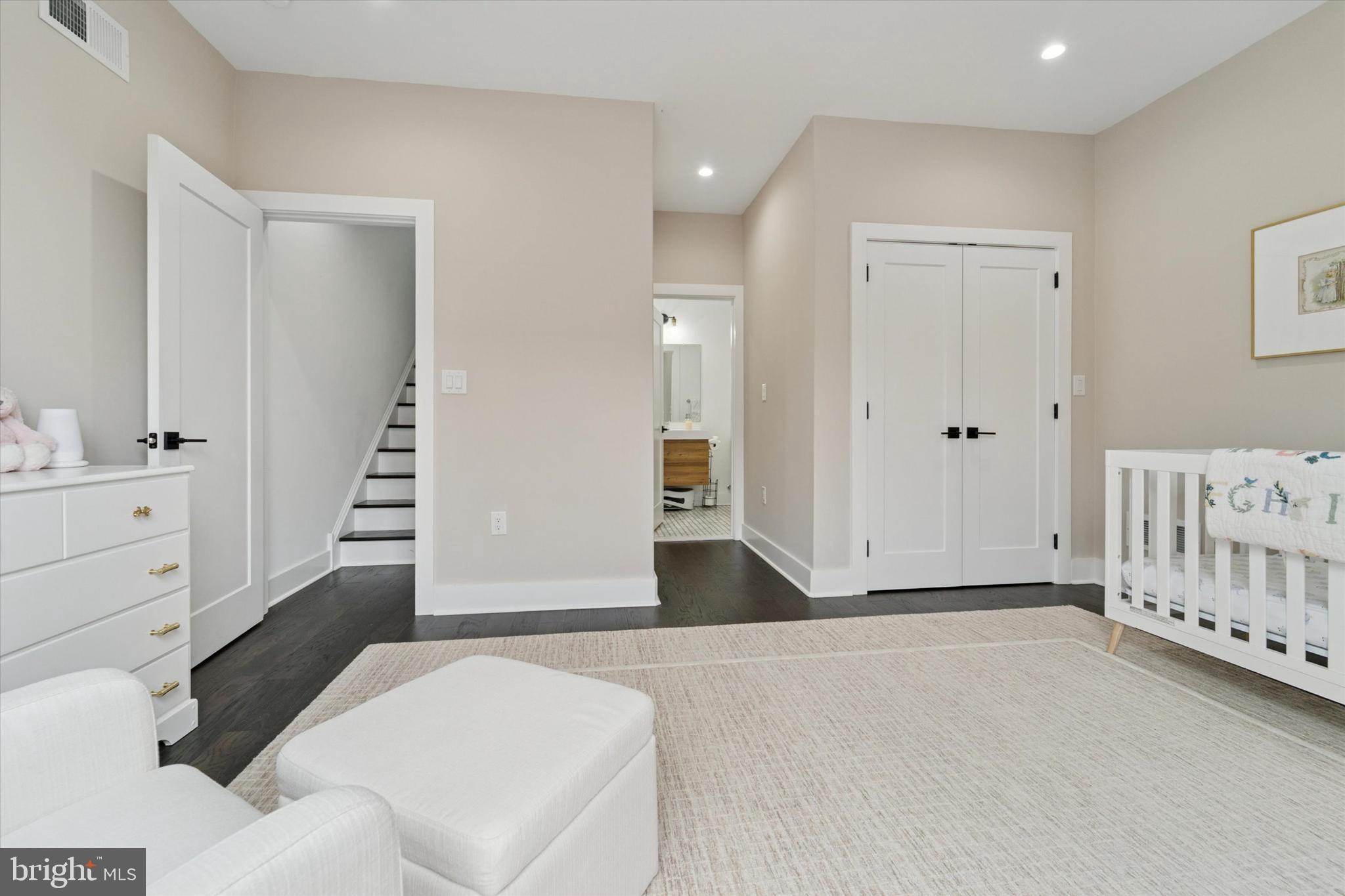 73 East Sharpnack Street Philadelphia, PA 19119 - Photo 35 of 50 a view of a bedroom with furniture and staircase