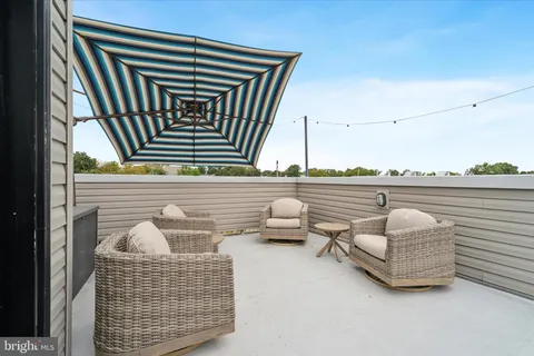 a view of a terrace with furniture