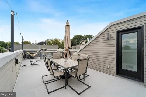 a view of terrace with seating space and barbeque oven