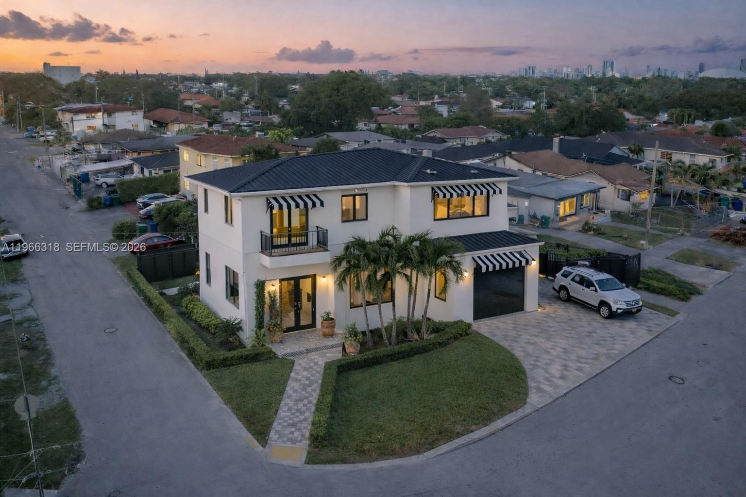 345 Southwest 36th Avenue Miami, FL 33135 - Photo 6 of 13 an aerial view of residential houses with outdoor space and trees