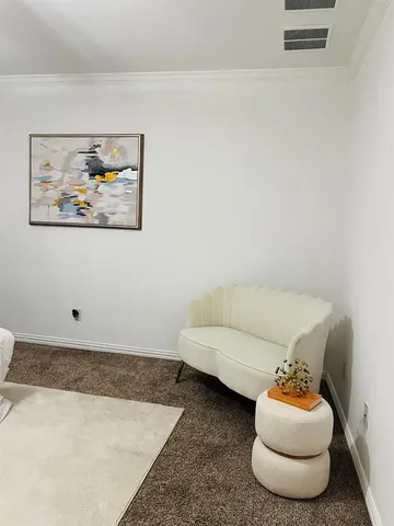 a living room with furniture and a couch