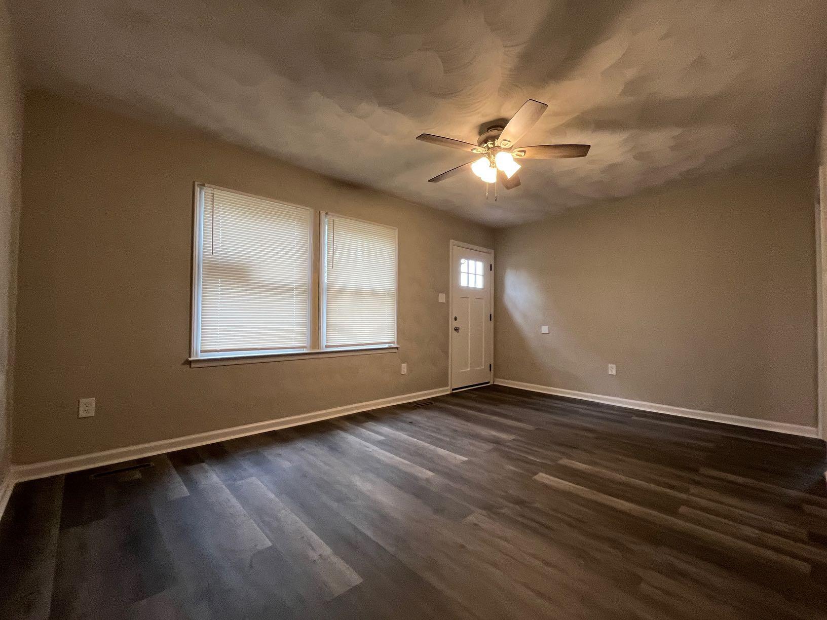1334 Belleview Avenue Southeast Roanoke, VA 24014 - Photo 2 of 13 a view of empty room with wooden floor and fan