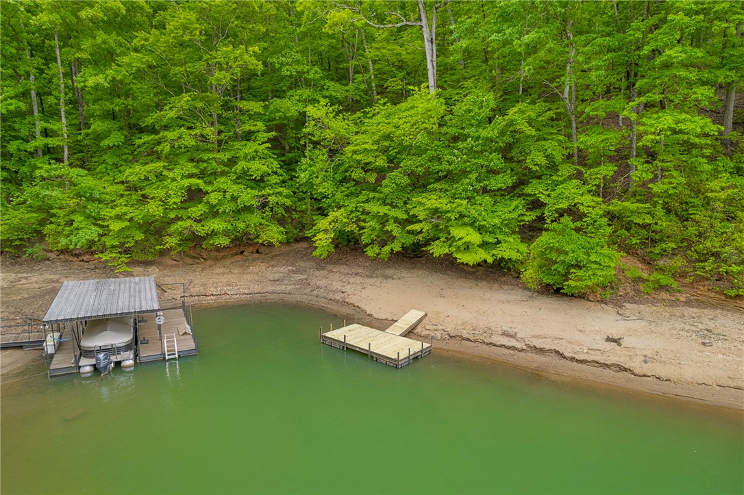 5 Shelor Ferry Road Fair Play, SC 29643 - Photo 3 of 17 Overhead view showing the dock positioned in water along a quiet, wooded Lake Hartwell shoreline.