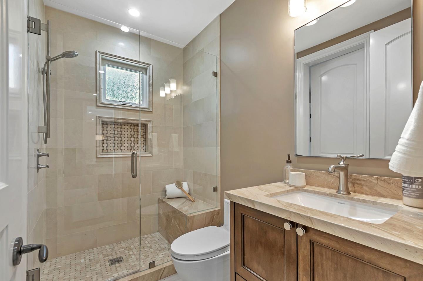 15681 Kennedy Road Los Gatos, CA 95032 - Photo 63 of 155 a bathroom with a granite countertop shower sink vanity mirror and toilet