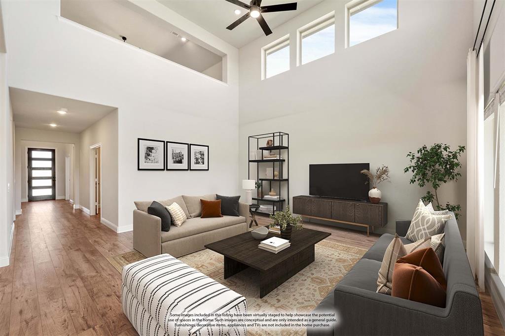 11716 Flathead Court Godley, TX 76044 - Photo 15 of 40 a living room with furniture and a flat screen tv