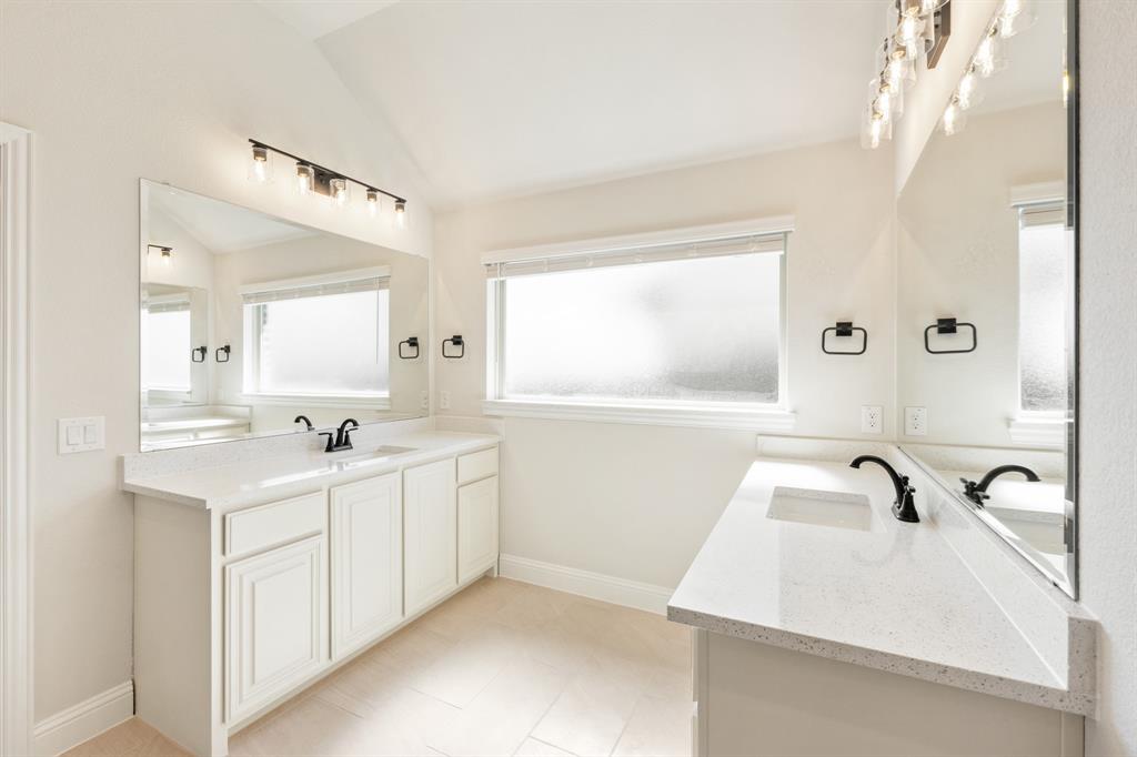 11716 Flathead Court Godley, TX 76044 - Photo 27 of 40 a bathroom with a sink and a mirror