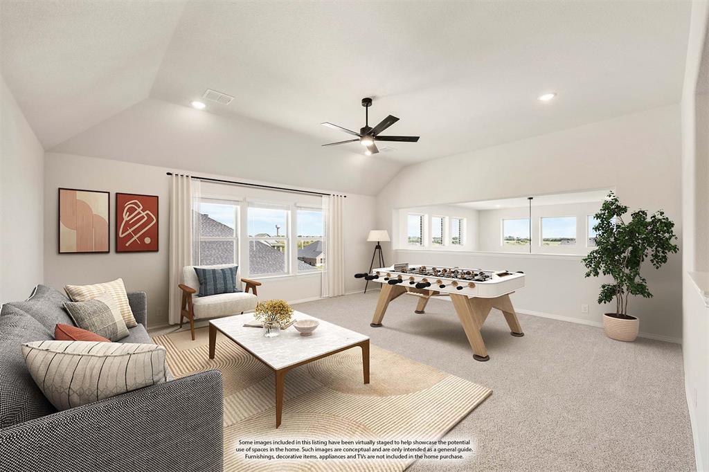11716 Flathead Court Godley, TX 76044 - Photo 31 of 40 a living room with furniture a rug and a chandelier