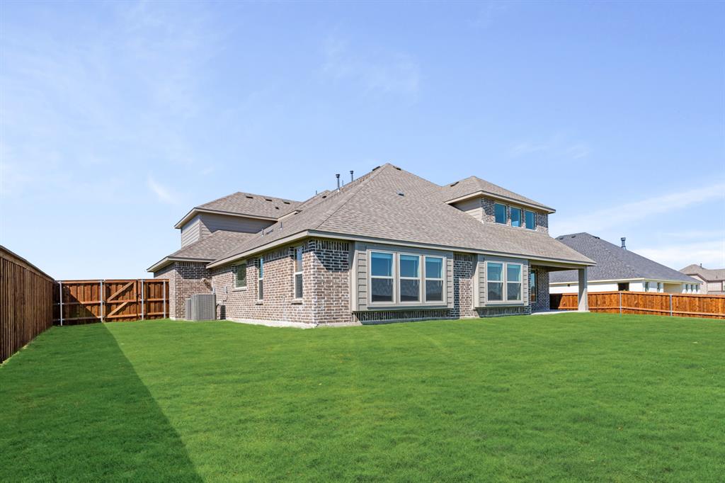 11716 Flathead Court Godley, TX 76044 - Photo 38 of 40 a front view of a house with a yard